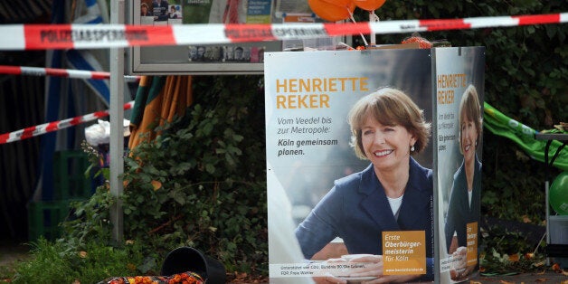 Election posters of independent candidate for the mayor of Cologne Henriette Reker stand behind a police barrier in Cologne,