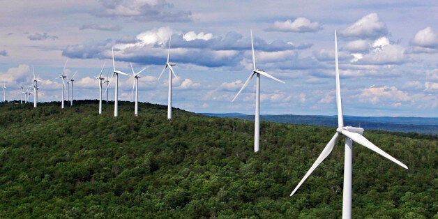 FILE- In this file photo made July 14, 2009, wind turbines line a ridge on Stetson Mountain in Stetson, Maine. The state now has 11 operational wind farms. New projects that are in conceptual stages, under review or approved but facing challenges could bring the state to half of its wind-power goal. (AP Photo/Robert F. Bukaty, File)