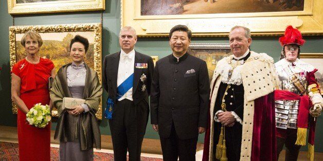 (L-R) Gilly Yarrow, wife of the Lord Mayor of London, the Chinese President's wife Peng Liyuan, Britain's Prince Andrew, the Duke of York, Chinese President Xi Jinping and The Lord Mayor of London Alan Yarrow pose at the Guildhall in central London before attending a banquet on October 21, 2015. British Prime Minister David Cameron today announced almost Â£40 billion (54.6 billion euros, $61.9 billion) in deals with China during a visit to Britain by President Xi Jinping. AFP PHOTO / JACK TAYLOR (Photo credit should read JACK TAYLOR/AFP/Getty Images)