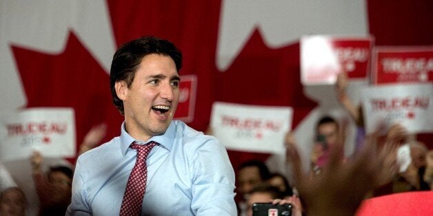 Canadian Liberal Party leader Justin Trudeau arrives at a victory rally in Ottawa on October 20, 2015. Canada is 'back' on the world stage, newly-elected prime minister Justin Trudeau said Tuesday after a landslide victory that ended nearly a decade of conservative rule. 'I want to say to this country's friends all around the world, many of you have worried that Canada has lost its compassionate and constructive voice in the world over the past 10 years,' Trudeau told a rally. 'On behalf of 35 million Canadians, we're back' AFP PHOTO/NICHOLAS KAMM (Photo credit should read NICHOLAS KAMM/AFP/Getty Images)