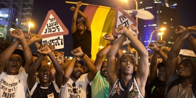 Hundreds of Ethiopian Israelis protestors demonstrate against police brutality and racism, as the protestors try to block a main road in the center of Tel Aviv on June 3, 2015. More than 135,000 Ethiopian Jews live in Israel, having immigrated to the Jewish state in two waves in 1984 and 1991. AFP PHOTO /MENAHEM KAHANA (Photo credit should read MENAHEM KAHANA/AFP/Getty Images)