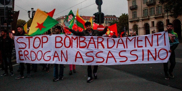 ITALY, TURIN, EUROPE - 2015/10/13: Demonstrators wave flags and bring placards against the Turkish President Erdogan and the