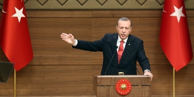 Turkish President Recep Tayyip Erdogan delivers a speech during a meeting with village chiefs at the Presidential Palace in Ankara on October 19, 2015. AFP PHOTO / ADEM ALTAN (Photo credit should read ADEM ALTAN/AFP/Getty Images)