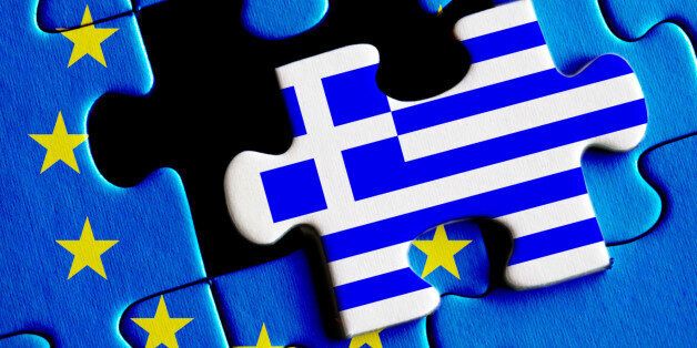 European Union crisis and Greece debt concept. Greek flag on missing puzzle.