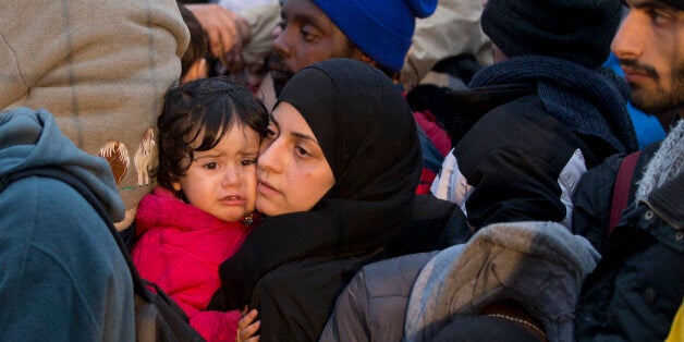 Migrants cue to enter Austria in Sentilj, Slovenia, Thursday, Oct. 29, 2015. Asylum-seekers hoping to reach Western Europe turned to crossing Slovenia after Hungary closed its border with Croatia with a barbed-wire fence. (AP Photo/Darko Bandic)