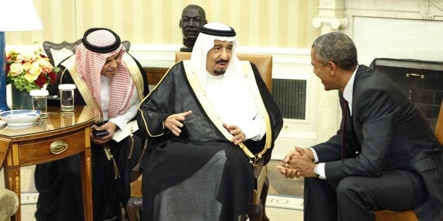 King Salman bin Abd alAziz of Saudi Arabia (C) speaks with US President Barack Obama during their meeting in the Oval Office
