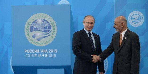 UFA, RUSSIA - JULY 10: In this handout image supplied by Host Photo Agency/RIA Novosti, President of the Russian Federation Vladimir Putin, left, and President of the Islamic Republic of Afghanistan Ashraf Ghani Ahmadzai during the welcome ceremony for the SCO heads of state. during the BRICS/SCO Summits - Russia 2015 on July 10, 2015 in Ufa, Russia. (Photo by Host Photo Agency/Ria Novosti via Getty Images)