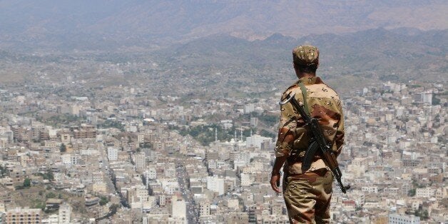 TAIZ, YEMEN - OCTOBER 29: A Yemeni soldier loyal to President Abd-Rabbu Mansour Hadi stands guard at the Cairo Castle, situated in the versant of Sabr mountain, historically used as government office by the Ottoman governors, which has been turned into ruins due to attacks of Ansarullah Movement (Houthi) rebels and forces loyal to former President Ali Abdullah Saleh in Taiz, Yemen on October 29, 2015. (Photo by Abdulnasser Al Seddik /Anadolu Agency/Getty Images)