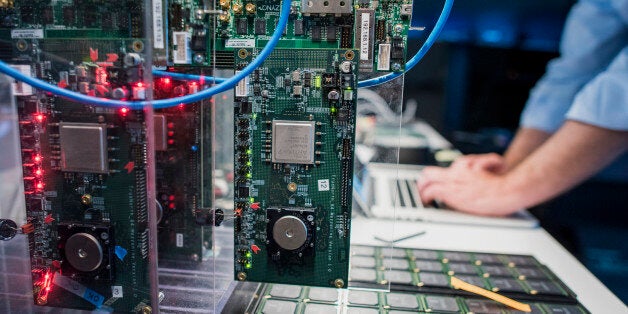 Rodrigo Alverez, system engineer for International Business Machines Corp. (IBM), tests new SyNAPSE chips at the IBM Almaden Research Center in San Jose, California, U.S., on Thursday, April 16, 2015. International Business Machines Corp. is scheduled to release earnings figures on April 20. Photographer: David Paul Morris/Bloomberg via Getty Images 