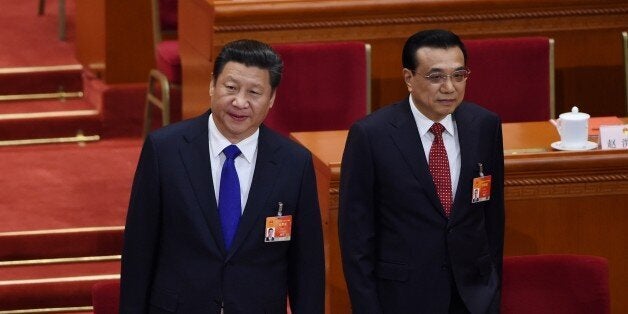 Chinese President Xi Jinping (L) and Premier Li Keqiang (R) arrive for the closing of the 3rd Session of the 12th National People's Congress at the Great Hall of the People in Beijing on March 15, 2015. China's Communist Party-controlled legislature, the National People's Congress (NPC), gathered in the capital for the annual show of political theater, with the 'rule of law' high on the agenda. AFP PHOTO / WANG ZHAO (Photo credit should read WANG ZHAO/AFP/Getty Images)