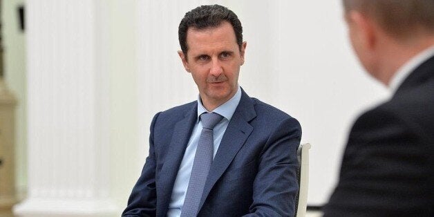 MOSCOW, RUSSIA - OCTOBER 21: Syrian President Bashar al-Assad meets with Russian President Vladimir Putin (not seen) at the K