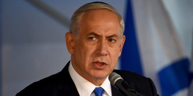 Israeli Prime Minister Benjamin Netanyahu speaks at a memorial service marking the 20th anniversary of the assassination of late prime minister Yitzhak Rabin in the Mt. Herzl Cemetery in Jerusalem, on October 26, 2015. Rabin was assassinated by an Israeli right-wing extremist who opposed his concessions for peace with the Palestinians. AFP PHOTO / POOL / DEBBIE HILL (Photo credit should read DEBBIE HILL/AFP/Getty Images)