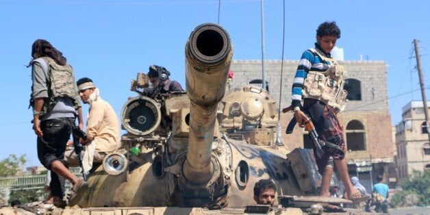 TAIZ, YEMEN - NOVEMBER 16: Members of the Yemeni Popular Resistance forces fight against Houthis in Wadi Al Dahli region in Taiz, Yemen on November 16, 2015. (Photo by Stringer/Anadolu Agency/Getty Images)