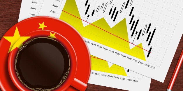 coffee with chinese flag and stock exchange chart lying on wooden desk