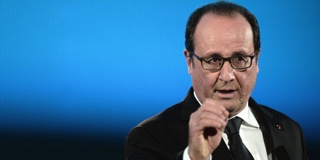 French President Francois Hollande delivers a speech during a meeting with elected representatives of the County Council of o