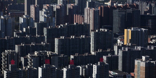 Residential buildings stand in Beijing, China, on Monday, Sept. 8, 2014. China is scheduled to release figures on consumer and producer prices on Sept. 11. Photographer: Brent Lewin/Bloomberg via Getty Images