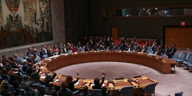 NEW YORK, NY - NOVEMBER 20: Delegates vote for a resolution during a UN Security Council meeting in New York on November 20, 2015. The UN Security Council on Friday unanimously adopted a French-drafted resolution aimed at coordinating international efforts to defeat Daesh. Drafted in the wake of last week's terrorist attacks in Paris, the resolution calls on all able countries to 'take all necessary measures' under international law to eradicate safe havens Daesh created in Syria and Iraq. (Photo by Cem Ozdel/Anadolu Agency/Getty Images)