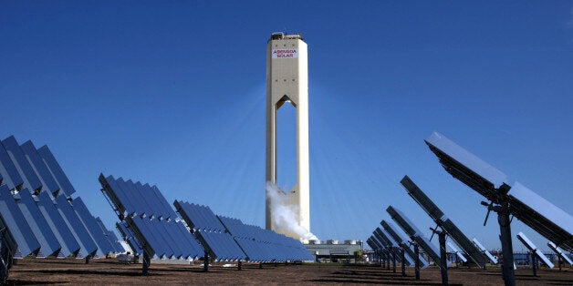 SPAIN - APRIL 28: Over 600 solar troughs, which act like giant mirrors, redirect the sun's rays to a central tower which heats water to generate steam to power turbines, at the Abengoa solar-thermal plant near Seville, Spain, on Monday, April 28, 2008. Spain has turned itself into the world's biggest builder of solar-energy plants, attracting developers from France and the U.S. by guaranteeing prices that weigh down Spanish consumers. (Photo by Markel Redondo/Bloomberg via Getty Images)