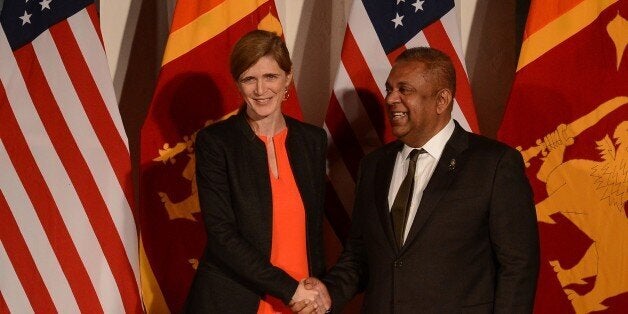 United States Ambassador to the United Nations Samantha Power (L) shakes hands with Sri Lanka's Foreign Minister Mangala Sama