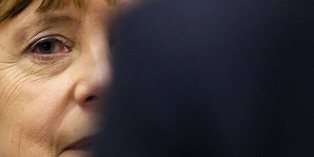 German Chancellor Angela Merkel arrives to a special faction meeting of the Christian Union parties at the Reichstag building in Berlin, Thursday, Nov. 26, 2015. (AP Photo/Markus Schreiber)