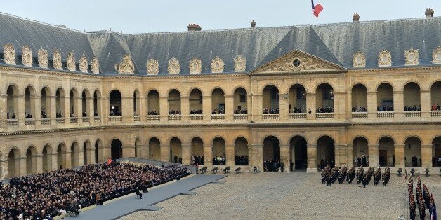 PARIS, FRANCE - NOVEMBER 27 : French President Francois Hollande, members of the French government, officials and guests attend ceremony to pay a national homage to the victims of the Paris attacks at Les Invalides in Paris, France on November 27, 2015. (Photo by Mustafa Yalcin/Anadolu Agency/Getty Images)