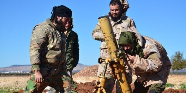 ALEPPO, SYRIA - DECEMBER 03: Members of opposition groups make preparations during the US-led coalition airstrikes against DA