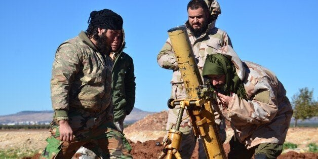 ALEPPO, SYRIA - DECEMBER 03: Members of opposition groups make preparations during the US-led coalition airstrikes against DAESH positions at Brekida village in Aleppo, Syria on December 03, 2015. (Photo by Huseyin Nasir/Anadolu Agency/Getty Images)