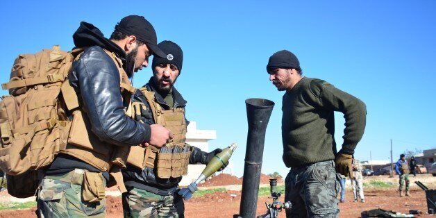 ALEPPO, SYRIA - DECEMBER 03: Members of opposition groups make preparations during the US-led coalition airstrikes against DAESH positions at Brekida village in Aleppo, Syria on December 03, 2015. (Photo by Huseyin Nasir/Anadolu Agency/Getty Images)