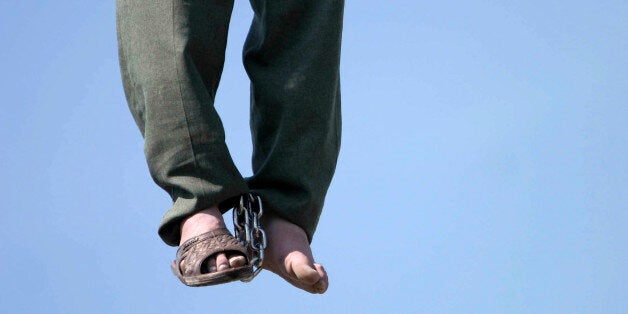 PAKDASHT, IRAN - MARCH 16: Iranian serial killer Mohammad Bijeh, 22, who has been convicted of kidnapping and murdering 21 p