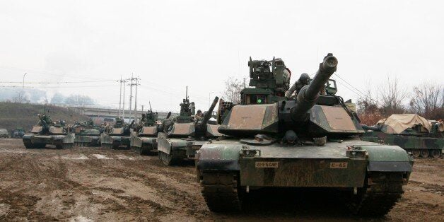 U.S. M1A2 SEP Abrams battle tanks prepare to cross the Hantan river during a river crossing operation, part of an annual joi