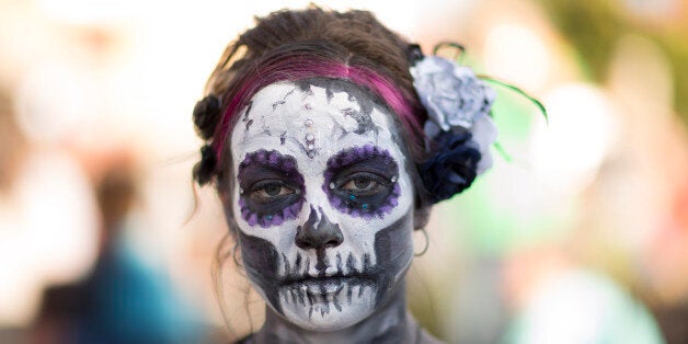 OKLAHOMA CITY, OK - NOVEMBER 1: Tracy Stevens poses for photos during the Dia de los Muertos (Day of the Dead) celebration, November 1, 2015 in Oklahoma City, Oklahoma. A 'Catrina parade' was featured, which officials said would break a world record for people dressed as 'La Calavera Catrinas' and 'Catrins'. The world record for the most in one place is 509 by Mexico City. (Photo by J Pat Carter/Getty Images)