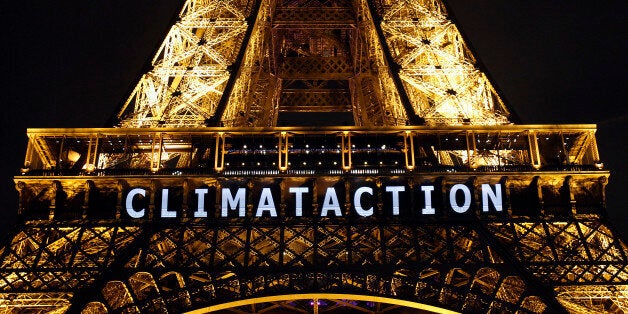 PARIS, FRANCE - DECEMBER 11: The slogan 'Climat action' is projected on the Eiffel Tower as part of the World Climate Change Conference 2015 (COP21) on December 11, 2015 in Paris, France. COP21 President Laurent Fabius unveiled the final draft text of a global climate agreement of negotiations in Paris. (Photo by Chesnot/Getty Images)