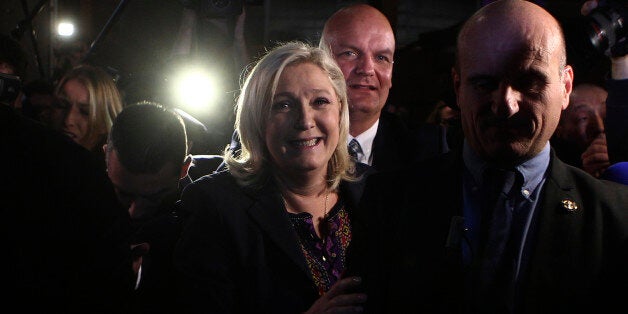 Far Right National Front party leader Marine Le Pen leaves after the second round of the regional elections in Henin-Beaumont
