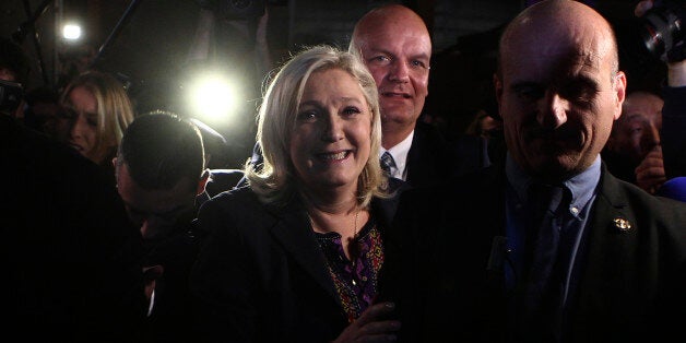 Far Right National Front party leader Marine Le Pen leaves after the second round of the regional elections in Henin-Beaumont, northern France, Sunday Dec.13, 2015. Marine Le Pen's far-right National Front collapsed in French regional elections Sunday after dominating the first round of voting, according to pollstersâ projections. (AP Photo/Michel Spingler)