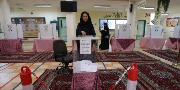 JEDDAH, SAUDI ARABIA- DECEMBER 12: Saudi women cast their votes for the municipal elections at a polling station on December 12, 2015 in Jeddah, Saudi Arabia. Saudi Women are running the municipal council seats as candidates for the first time in the Kingdom's history and also be allowed for the first time to vote in a governmental election. The Municipal councils are the only government body in which Saudi Arabian citizens can elect representatives, so the vote is widely seen as a small but significant opening for women to play a more equal role in society. (Photo by Jordan Pix/ Getty Images)