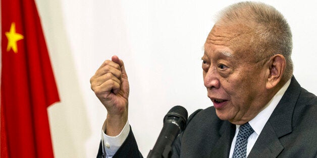 Former Hong Kong Chief Executive Tung Chee-hwa gestures during a press conference in Hong Kong, Wednesday, Sept. 3, 2014. (AP