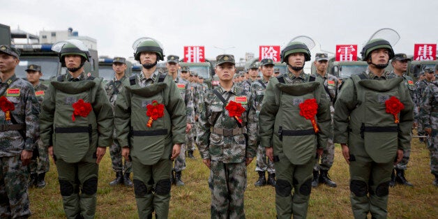 WENSHAN, CHINA - NOVEMBER 03: (CHINA OUT) PLA soldiers attend a rally to star the mine clearance mission on the border with Vietnam on November 3, 2015 in Wenshan Zhuang and Miao Autonomous Prefecture, Yunnan Province of China. Over 400 PLA soldiers of Chengdu Military Area Command began a mission from Tuesday to remove more than 470,000 mines before the end of 2017 in Yunnan on the border with Vietnam. It was the third mission following two previous mine clearances on the border in 1992-1994 and 1997-1999. (Photo by Meng Zhubin/ChinaFotoPress via Getty Images)