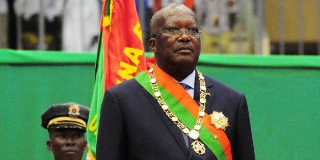 Burkina Faso's new president Roch Marc Christian Kabore is pictured following his swearing-in ceremony in Ouagadougou on December 29, 2015. Kabore was sworn in as Burkina Faso's president on December 29, completing a transition from the 2014 overthrow of longtime ruler Blaise Compaore in the troubled west African country. Kabore, 58, Burkina Faso's first new leader in almost three decades, embarks on the first of two possible five-year terms. / AFP / AHMED OUOBA (Photo credit should read AHMED OUOBA/AFP/Getty Images)