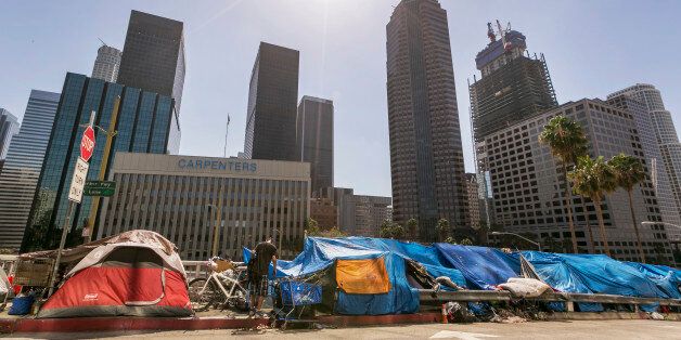 FILE - In this Tuesday, Sept. 22, 2015 file photo, tents used by the homeless line a downtown Los Angeles street. Senate President Pro Tem Kevin de Leon, D-Los Angeles, announced Monday, Jan. 4, 2106, a proposal to spend more than $2 billon on permanent housing to deal with the state's homeless population. (AP Photo/Damian Dovarganes, File)