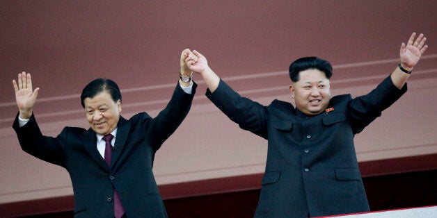 In this Oct. 10, 2015, file photo, North Korean leader Kim Jong Un, right, joins hands and waves with visiting Chinese official Liu Yunshan, the Communist Party's fifth-ranking leader, during a parade in Pyongyang, North Korea. China sees North Korea's claim to have conducted its first hydrogen bomb test on Wednesday, Jan. 6, 2016, as yet another act of defiance, boding ill for a relationship already under strain. (AP Photo/Wong Maye-E, File)