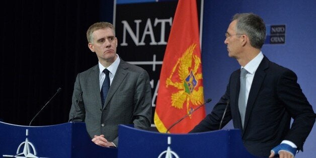 BRUSSELS, BELGIUM - DECEMBER 02: NATO Secretary General Jens Stoltenberg (R) and Montenegro's Deputy Prime Minister and Minister of Foreign Affairs and European Integration, Igor Luksic (L) hold a joint press conference on the second day of the NATO Foreign Ministers meeting at the NATO headquarters in Brussels, Belgium on December 02, 2015. NATO foreign ministers on Wednesday invited Montenegro to become the 29th member of the alliance in its first expansion in six years. (Photo by Dursun Aydemir/Anadolu Agency/Getty Images)