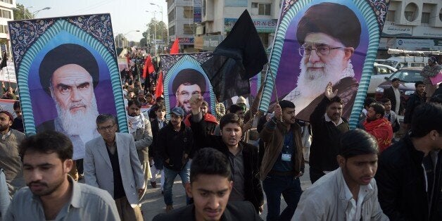 Pakistani Shiite Muslims march during a protest in Islamabad on January 8, 2016, against the Pakistan's government decision to join a Saudi Arabian-led coalition against extremism and the execution of prominent Shiite cleric Nimr al-Nimr. Hundreds of Shiites in Islamabad took to the streets on January 8 to protest Pakistan's decision to join a Saudi Arabian-led coalition against extremism, as the Saudi foreign minister ended a two-day visit to the country. The estimated 1,500 people also chanted slogans against Saudi's execution of Shiite cleric Sheikh Nimr al-Nimr on January 2, which sparked a deepening crisis between Riyadh and regional rival Iran. AFP PHOTO / Aamir QURESHI / AFP / AAMIR QURESHI (Photo credit should read AAMIR QURESHI/AFP/Getty Images)