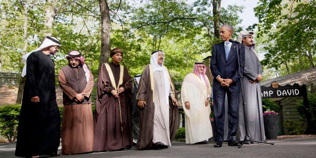 President Barack Obama, center, waits for from left, Abu Dhabi crown prince Sheikh Mohammed bin Zayed Al Nahyan; Bahrain Crown Prince Prince Salman bin Hamad Al-Khalif; Deputy Prime Minister of Oman, Sayyid Fahad Bin Mahmood Al Said; Kuwait's Emir Sheik Sabah Al-Ahmad Al-Jaber Al-Sabah; Saudi Arabia Crown Prince Mohammed bin Nayef; and Qatar's Emir Sheikh Tamim bin Hamad Al-Thani; to make a statement following their meetings at Camp David in Maryland, Thursday, May 14, 2015. Obama and leaders from six Gulf nations are trying to work through tensions sparked by the U.S. bid for a nuclear deal with Iran, a pursuit that has put regional partners on edge. Obama is seeking to reassure the Gulf leaders that the U.S. overtures to Iran will not come at the expense of commitments to their security.(AP Photo/Pablo Martinez Monsivais)