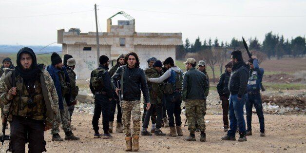 ALEPPO, SYRIA - JANUARY 17: Members of Syrian opposition Al-Sultan Murad Brigade and Al-Mutasim Battalion patrol at the Yanyaban village in Aleppo, Syria on January 17, 2016 after they took the region back from terrorist organization Daesh. (Photo by Huseyin Nasir/Anadolu Agency/Getty Images)