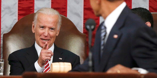 FILE - In this Jan. 12, 2016 file-pool photo, Vice President Joe Biden points at President Barack Obama during the president's State of the Union address to a joint session of Congress on Capitol Hill in Washington. Harking back to America's triumphant race into space, the Obama administration is launching what it calls a "moonshot" effort to cure cancer. Donât expect miracles in the president's last months, but there has been striking progress in recent years. (AP Photo/Evan Vucci, Pool, File)