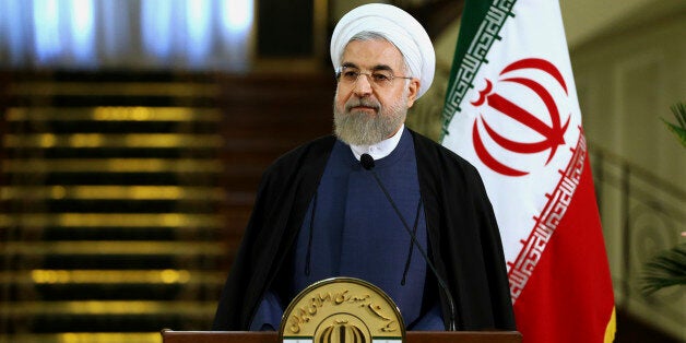 Iranian President Hassan Rouhani speaks with media in a joint press conference with his Iraqi counterpart Fouad Massoum after