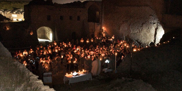 In this April 3, 2010, photo released by the U.S. Army, soldiers celebrate a Catholic Easter mass at St. Elijah's Monastery o