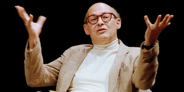 FILE - In this July 14, 1987, file photo, Massachusetts Institute of Technology's Marvin Minsky, speaks to the audience during a panel discussion whose topic was, "Artificial Intelligence: Society's Atlas or Achilles," at the Paramount Theater in Seattle. A pioneer in the field of artificial intelligence at MIT who saw parallels in the functioning of the human brain and computers has died. The university said Minsky died Sunday, Jan. 24, 2016, at Brigham and Women's Hospital in Boston of a cerebral hemorrhage. Minsky was 88. (AP Photo/Robert Kaiser, File)