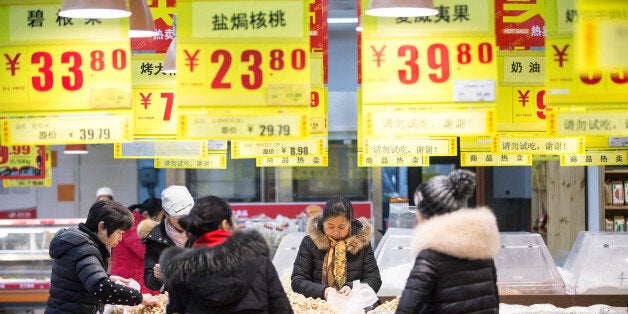 HANGZHOU, CHINA - JANUARY 19: (CHINA OUT) Citizens purchase goods at a supermarket on January 19, 2016 in Hangzhou, Zhejiang Province of China. China's GDP in 2015 was about 67.67 trillion yuan (10.29 trillion USD), grew by 6.9 percent which became the lowest growth rate during the last 25 years. (Photo by ChinaFotoPress/ChinaFotoPress via Getty Images)