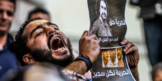 CAIRO, EGYPT - FEBRUARY 11: A protester is seen during a demonstration demanding the release of imprisoned journalists, in f